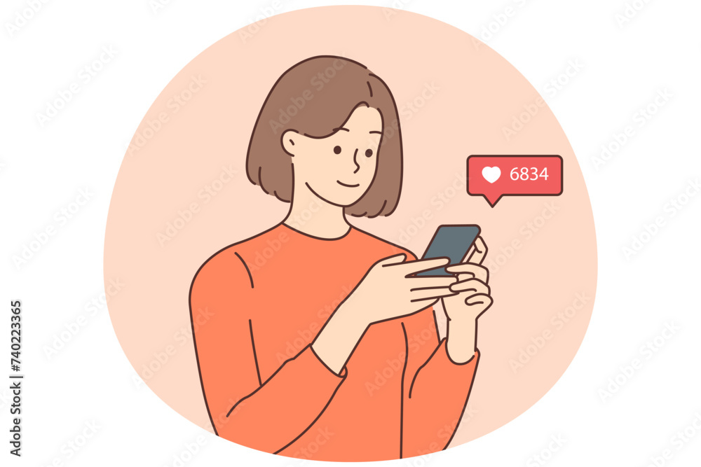 Smiling woman check likes on cellphone Smiling woman check likes on cellphone