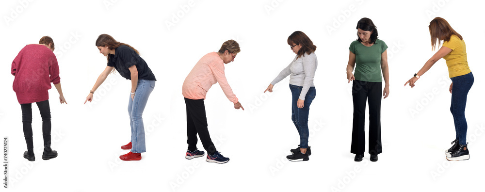 group of women pointing down on white background