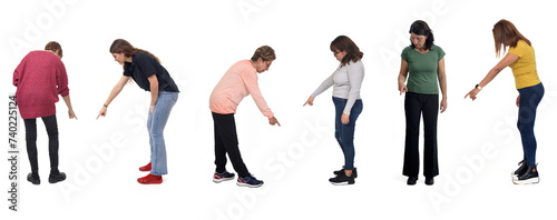 group of women pointing down on white background