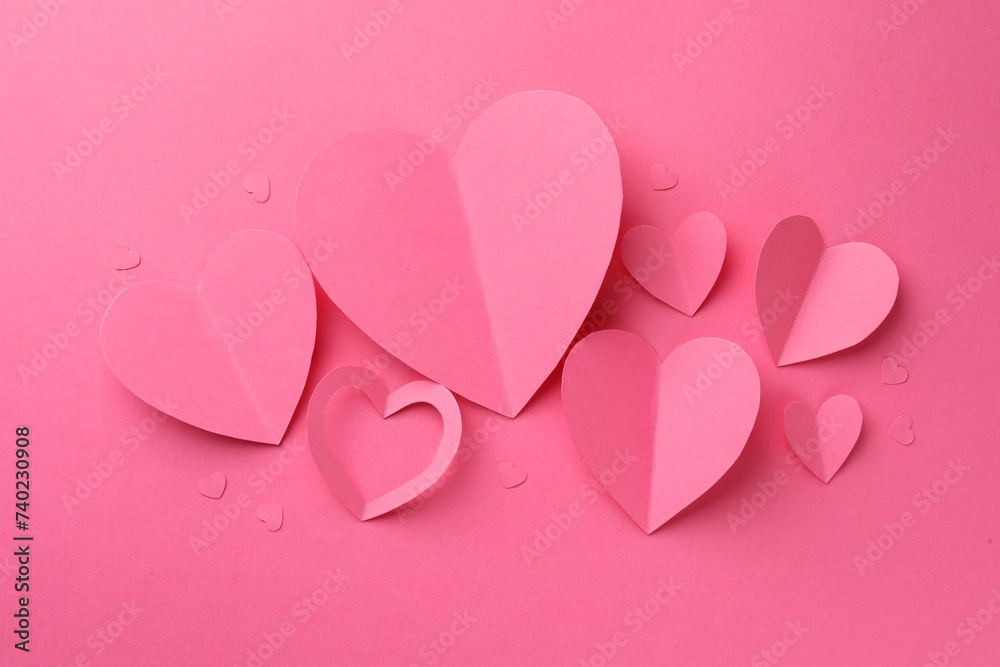Paper hearts on pink background, flat lay Paper hearts on pink background, flat lay
