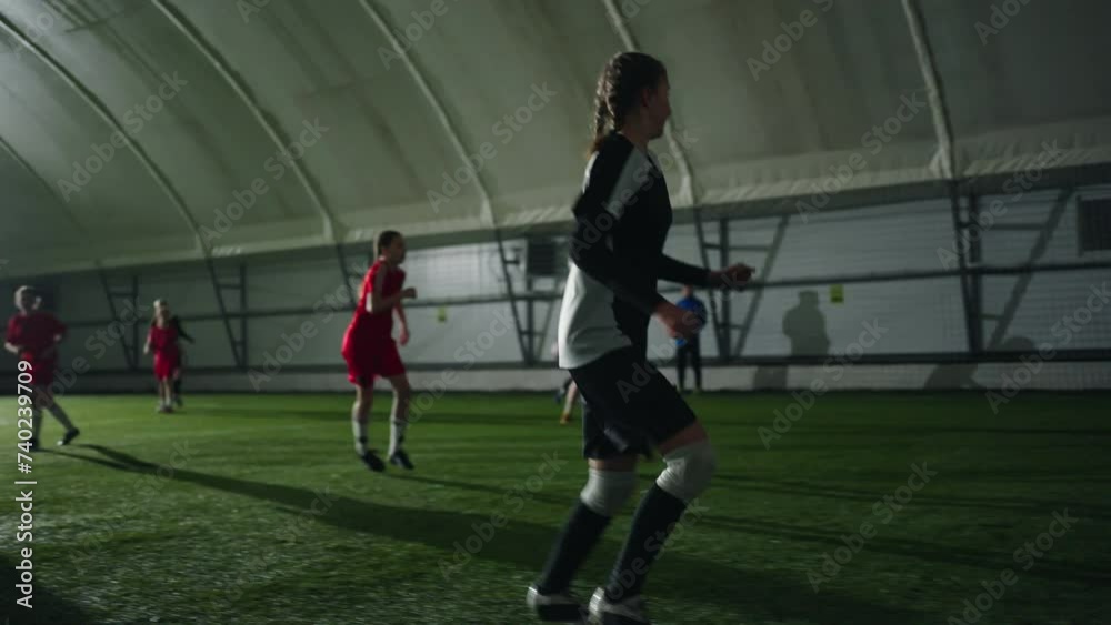 Teens Girls Playing Soccer In School Sports Hall, Adolescent Girls Running And Playing Football Teens Girls Playing Soccer In School Sports Hall, Adolescent Girls Running And Playing Football