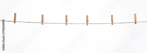 wooden clothespins on a rope on a white background isolate