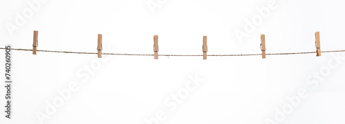 wooden clothespins on a rope on a white background isolate photo