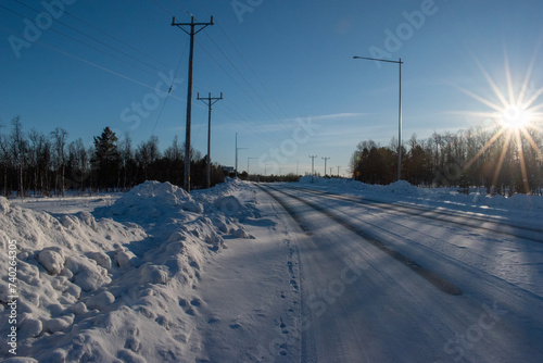 Snow covered road in arctic winter in Lapland, Sweden