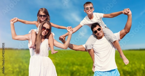 Happy young family have fun in the park.