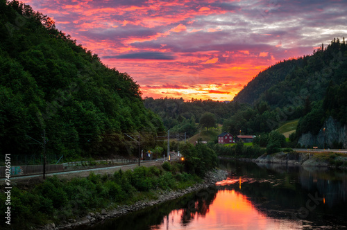 Fotografía Sunset with irradiated clouds in the sky in Norway
