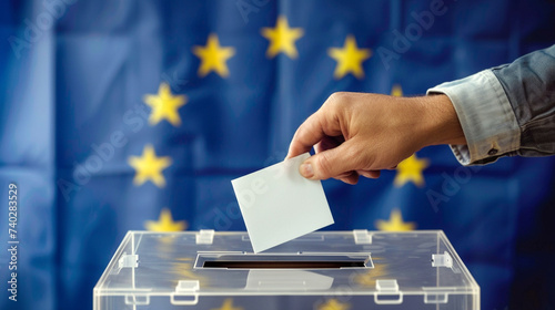 Man throwing his vote into the ballot box. Elections to the European Parliament photo