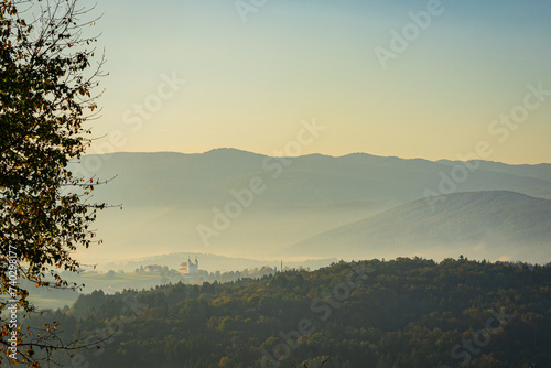 Beaufitul hills of dolenjska region, with the church in Zuzemberk as the main subject. Beautiful colorful landscape panorama. photo