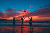 Silhouette of friends playing beach volleyball 