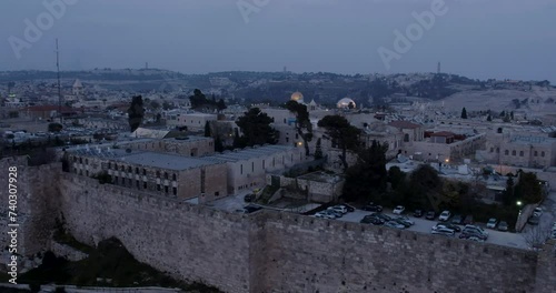Aerial Footage after sunset of the beautiful Old City of Jerusalem, Al-Aqsa Mosque and the Dome of the Rock.