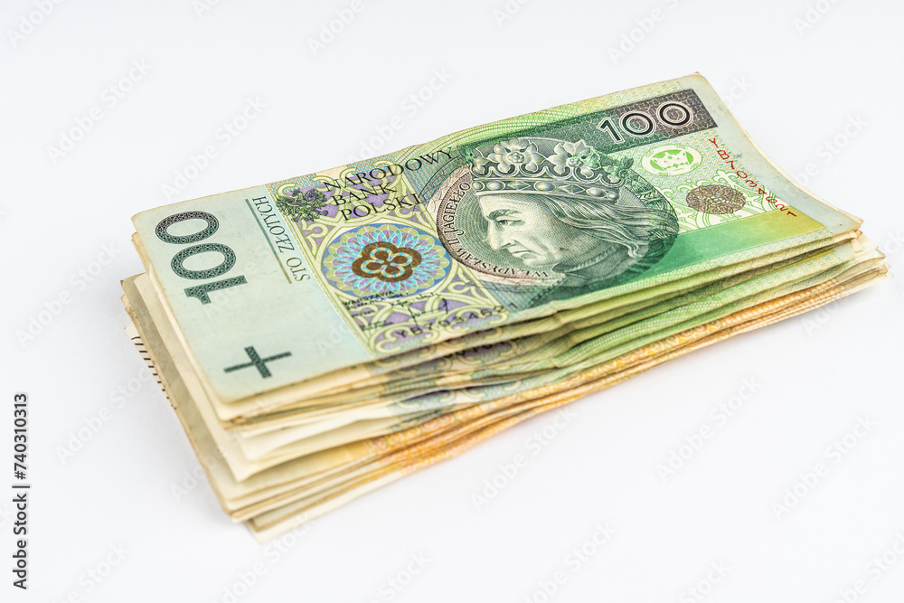 Stack of polish zloty banknotes. Money stack made of polish 100 and 200 zloty banknotes. Money isolated on white backgroud Stack of polish zloty banknotes. Money stack made of polish 100 and 200 zloty banknotes. Money isolated on white backgroud