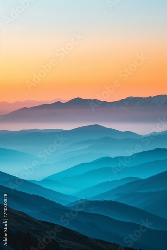 Gentle hills under gradient sunrise, warm tones above and cool blues blanketing slopes