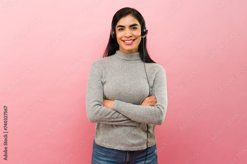 Beautiful hispanic woman working as a sales agent at the call center Beautiful hispanic woman working as a sales agent at the call center