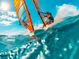 Two windsurfers ride the waves on a sunny summer day, close-up