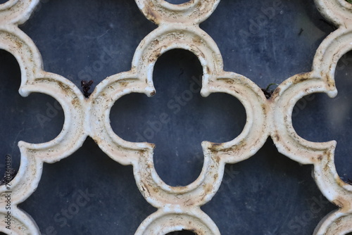 ancient rusty wrought ornamented metal surface