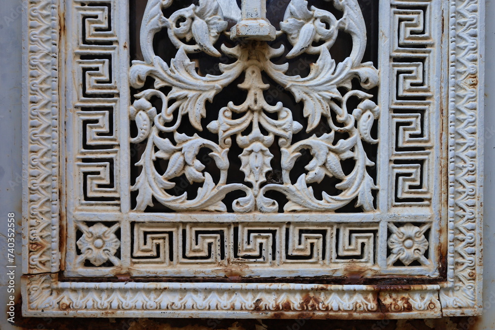 close up ancient weathered wrought metal  ornaments 