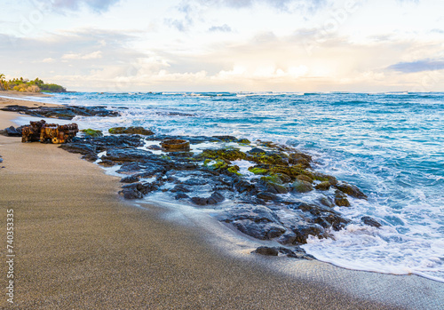 Waves Washing Over Volcanic Shoreline on Kapalaoa Beach , Anaehoʻomalu Bay, Hawaii Island, Hawaii, USA photo