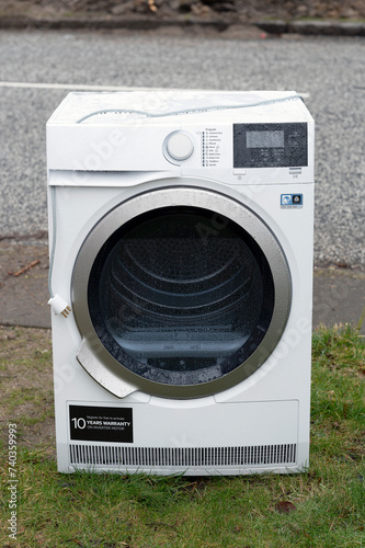 Washing machine outside on a rainy day