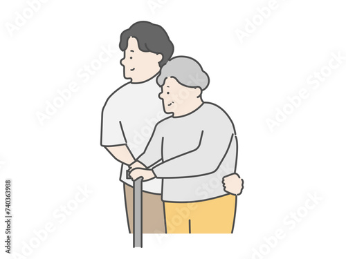 高齢女性の歩行介助をする男性介護士