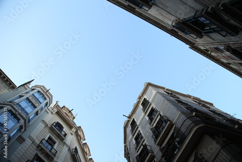 the sky through Spanish buildings
