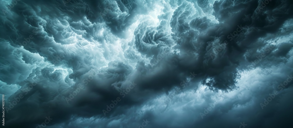 A gloomy atmosphere with dense cumulus clouds filling the sky, creating a dark and ominous look. The electric blue hue of the clouds contrasts with the calm horizon