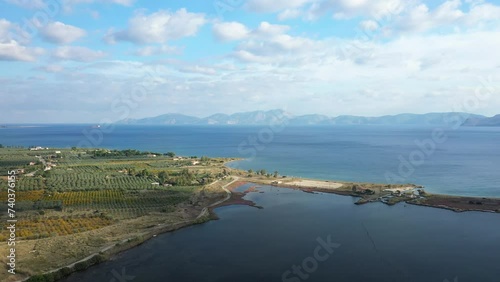 The green countryside by the Myrto Sea in Europe, Greece, Peloponnese, Argolis, towards Hermione, in summer, on a sunny day. photo