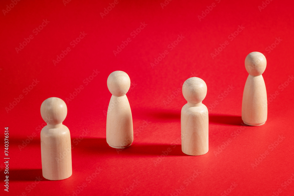Family people figures on red background. Concept of family, values, unity, togetherness and relationship. Family people figures on red background. Concept of family, values, unity, togetherness and relationship.