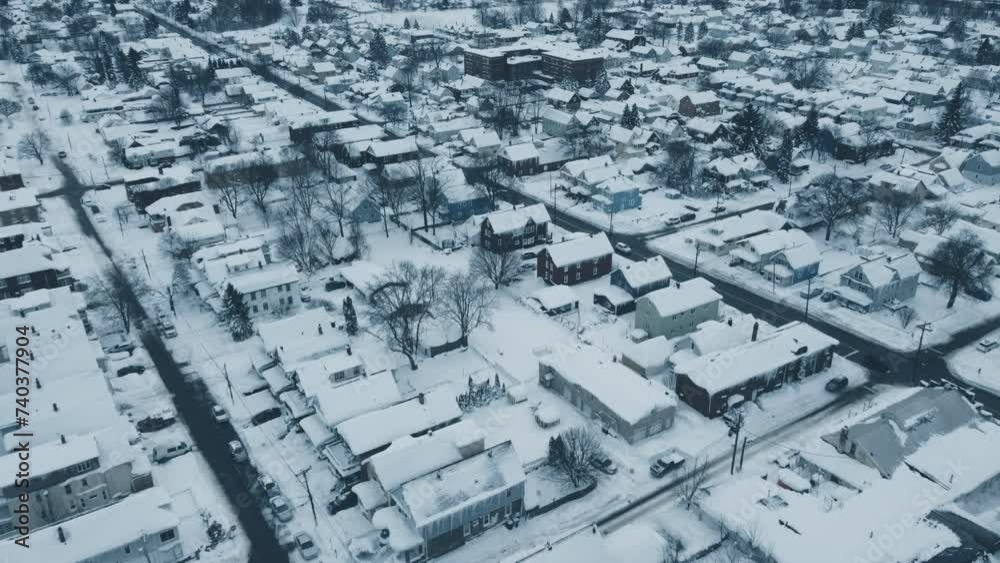 Flying over a snow-covered neighborhood during the middle of winter. Flying over a snow-covered neighborhood during the middle of winter.