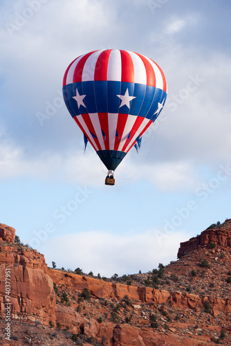 hot air balloons floating over southern Utah desert