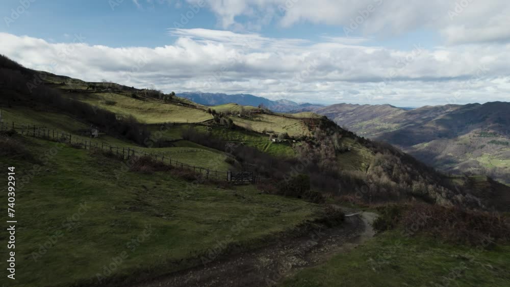 Speeding over fenced lush grassy fields amongst the beautiful mountainous landscape
Speeding over fenced lush grassy fields amongst the beautiful mountainous landscape