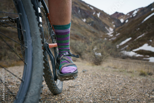 person riding a bike in the mountains