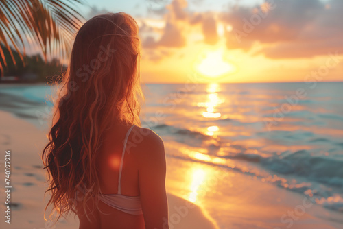 Woman at sunset beach.