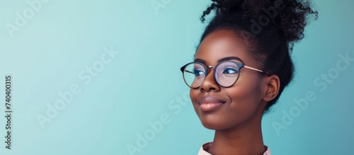 Portrait of a stylish young woman wearing glasses and looking confident and smart photo