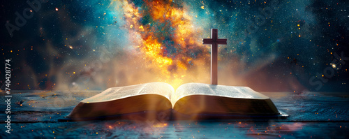 Christian symbols of faith with the cross and bible illuminated by the first light of dawn on a cosmic background photo