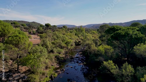 Sierra de Andujar landscape and River Jandula Andalusia Spain DRONE VERTICAL REVEAL photo