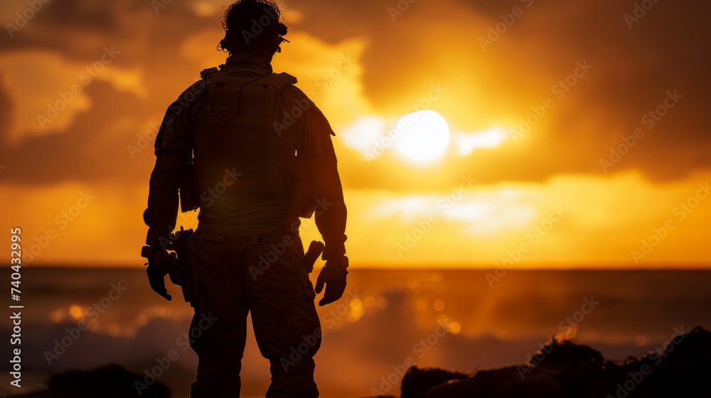 Silhouette of a solitary soldier in full gear standing on a rocky shoreline, contemplating the vast ocean against the backdrop of a dramatic sunset.