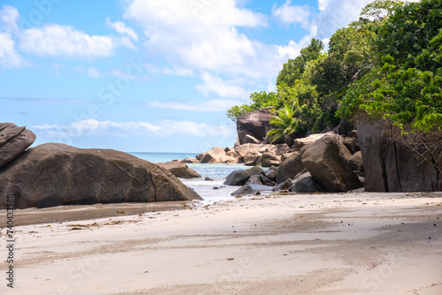 big boulders rock on the empty beach on Mahe in the morning, Seychelles