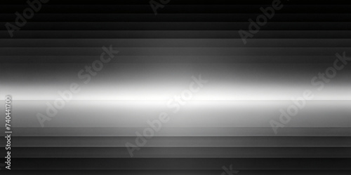 Silver metallic lines on textured gray backdrop with light