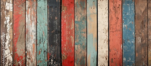 This close-up photo showcases a wooden wall with grunge-infused charm and vintage appeal, featuring various colors and textures in its weathered panels.