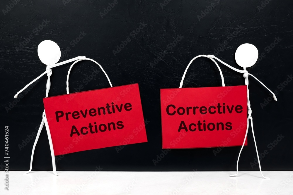 Stick figure holding preventive and corrective action placard in black background. Root cause analysis concept.