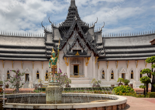 Colorful detailed architecture of Dusit Maha Prasat Throne Hall pagoda temple building exterior at Ancient City Siam Bangkok Thailand photo