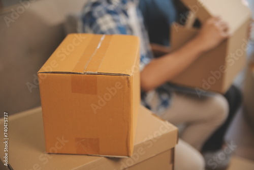 Two Asian blogger showing clothes in front of the camera to recording vlog video live streaming at her shop. Online Shopping Cart notion. on sofa at home