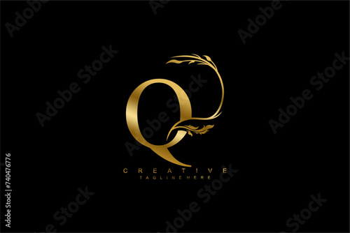 luxury gold letter Q logo design with beautiful flower and leaf ornaments. monogram Q, logo typography. initials Q. typography. for business logos, boutiques, companies, beauty, etc photo