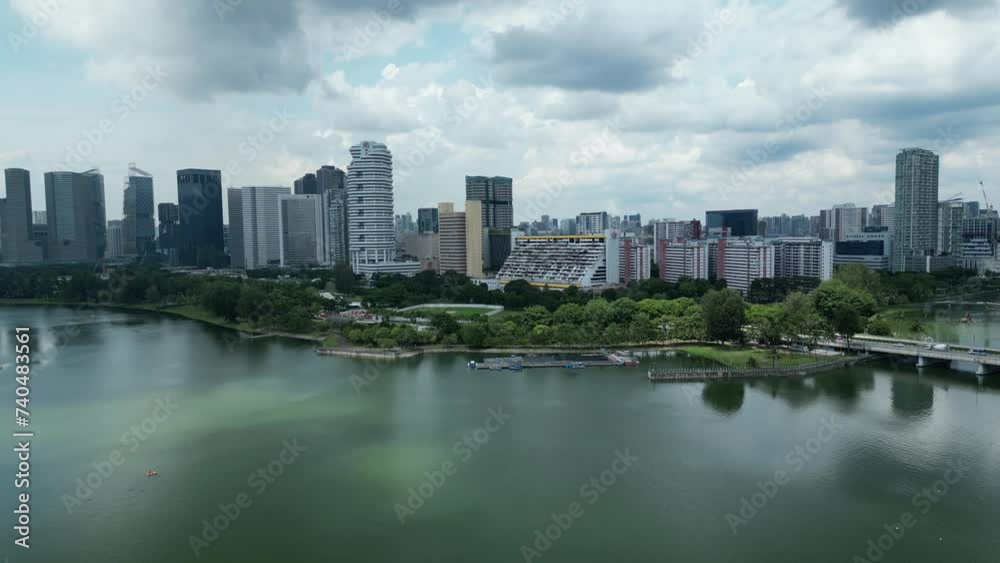 Drone shot of Marina Bay Republic Ave, Nicoll Highway and Kampong Glam Area. Camera slowing pushing in towards city while panning towards Singapore Flyer and Marina Bay Sands Hotel. Drone shot of Marina Bay Republic Ave, Nicoll Highway and Kampong Glam Area. Camera slowing pushing in towards city while panning towards Singapore Flyer and Marina Bay Sands Hotel.