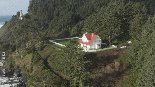 Drone rises over the Haceta Head assistant lightkeeper's house in Oregon. photo