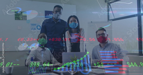 Image of financial data processing over diverse business people with face masks at meeting