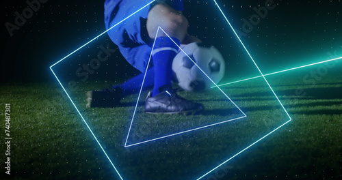 Image of neon scanner processing data over football on pitch