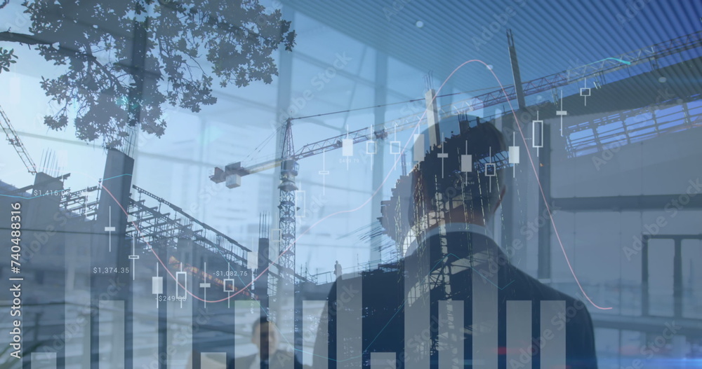 Fototapeta premium Image of statistics processing over businessman