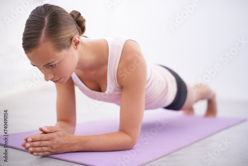 Yoga, pushup and woman with stretching for fitness, natural exercise and balance in home. Workout, pilates and healthy body of girl on mat for morning muscle warm up, wellness and self care mission.