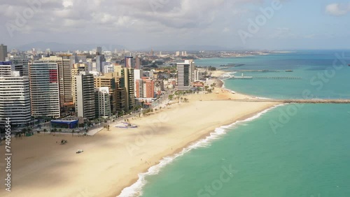 Aerial view of the buldings in front of the sea, the empty beach in a cloudy day, Fortaleza, Ceara, Brazil photo